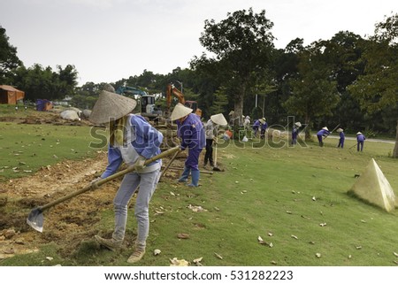 Flamingo Dai Lai, Vinh Phuc province, Vietnam - October 13, 2016 : The female workers who are working with the rudimentary tools at Flamingo Dai Lai resort of Vinh Phuc Province, Vietnam