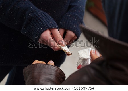 Drug dealer taking money for heroine and ecstasy