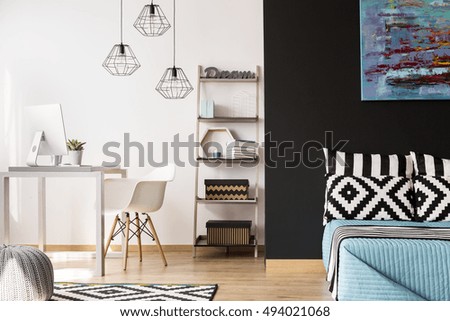 Black and white interior with modern furniture, pattern decorative details and new pendant lamps