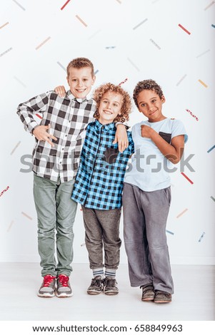 Young happy boys hugging and smiling in the photo