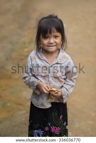 Children girl smile in traditional dress ,Tu Le Lao Cai,Vietnam.