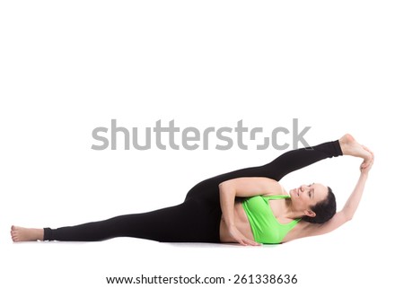 Beautiful Slim Girl Doing Yoga Workout Stretching Exercise For Legs Supta Visvamitrasana Pose Beautiful Slim Girl Doing Yoga Workout Stretching Exercise For Legs Supta Visvamitrasana Pose
