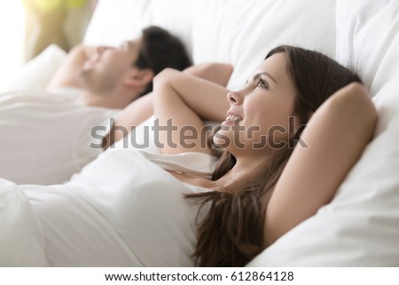 https://thumb1.shutterstock.com/display_pic_with_logo/2780032/612864128/stock-photo-side-view-of-happy-woman-looking-up-lying-in-comfortable-bed-with-beloved-man-cute-married-couple-612864128.jpg