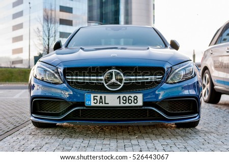 PRAGUE, THE CZECH REP., NOVEMBER 27, 2016: Closeup of new luxury car Mercedes-Benz c-class C63, parking in front of car store. Detail front view of cars