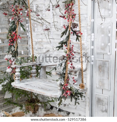 Christmas Decorations In The Rustic Style Snow Covered Wooden Swing Christmas Decorations In The Rustic Style Snow Covered Wooden Swing