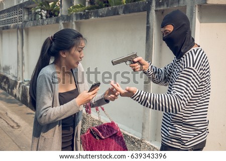 Males Being Bobbed | scared young asian woman being robbed stock photo Males Being Bobbed | scared young asian woman being robbed stock photo