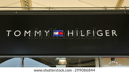 London, UK - June 14, 2015: Detail of the entrance to a Tommy Hilfiger store. Tommy Hilfiger is a famous American fashion designer for men, women and children apparel, sportswear, etc.