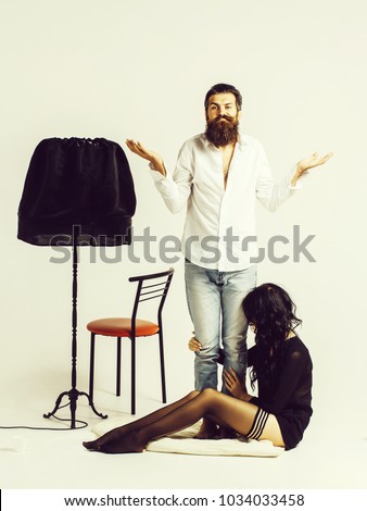 https://thumb1.shutterstock.com/display_pic_with_logo/2810074/1034033458/stock-photo-handsome-bearded-man-with-stylish-hair-mustache-and-beard-on-face-and-sexy-cute-pretty-woman-sits-1034033458.jpg