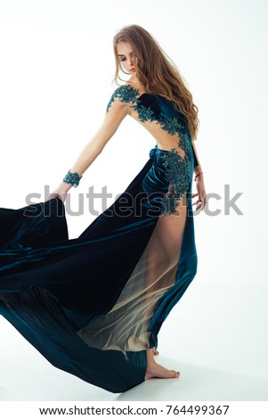 stock photo girl posing in blue evening dress barefoot model with stylish makeup isolated on white holiday 764499367