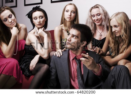 stock-photo-portrait-of-young-sexy-lovelace-man-surrounded-by-hot-women-wanting-of-proposal-from-him-64820200.jpg