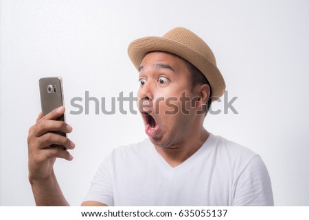 stock-photo-young-asian-man-looking-smartphone-and-feels-shock-and-surprise-with-overly-face-expression-635055137.jpg