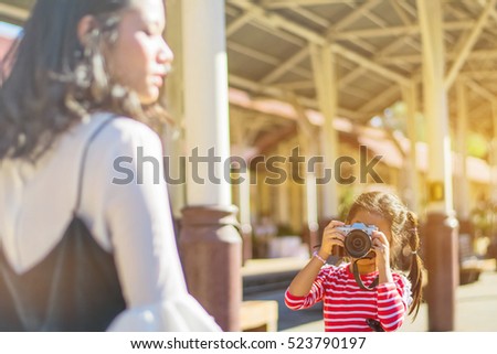 Happy loving family. Mother and her daughters children girls playing and making photo.