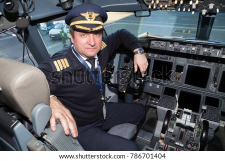 Boryspil, Ukraine - DECEMBER 26, 2017: Captain pilot at work. Airplane cockpit. Aviation technology. Traveling by plane.