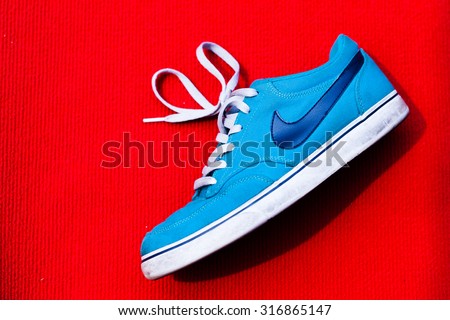 MALAYSIAN - SEPTEMBER 12 , 2015 : Nike shoes with red background and this photo in available light. This photo taken on september 12 , 2015 in malaysian.