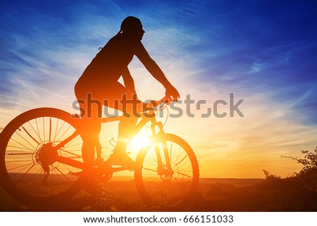 stock-photo-silhouette-of-a-cyclist-with
