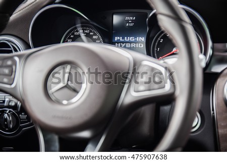 NOKIA, FINLAND - AUGUST 25, 2016: Mercedes-Benz GLC 350 e Plug-In Hybrid at the test-drive. Close up photo of the dashboard. Focus on the display with the words "Plug-In Hybrid".