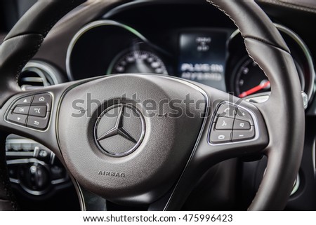 NOKIA, FINLAND - AUGUST 25, 2016: Mercedes-Benz GLC 350 e Plug-In Hybrid at the test-drive. Close up photo of the dashboard. Focus on the Mercedes star emblem.