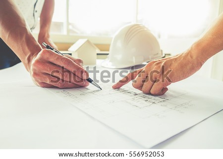 Hands of Engineer working on blueprint,Construction concept. Engineering tools.