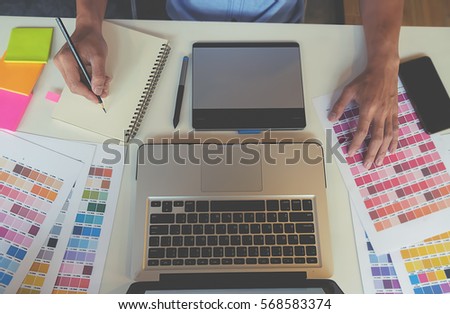 graphic design and color swatches and pens on a desk architectural drawing with work tools - Graphic Design Desks graphic design and color swatches and pens on a desk architectural drawing with work tools - Graphic Design Desks