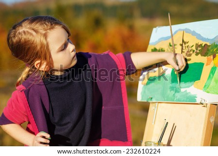 little painter at work with palette