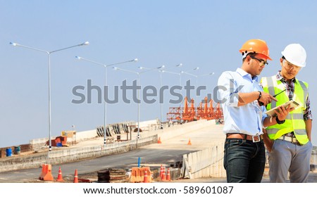 Engineers on construction sites, road and bridge.