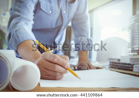Architect or engineer working in office, Construction concept. Engineering tools.Vintage tone retro filter effect,soft focus(selective focus).
