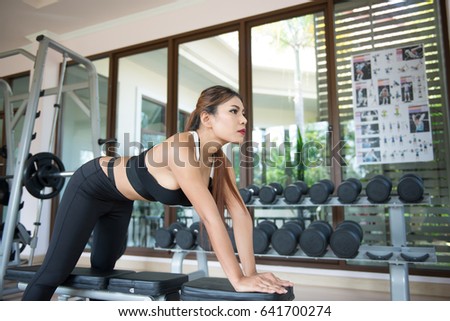 https://thumb1.shutterstock.com/display_pic_with_logo/2934415/641700274/stock-photo-asian-tan-fitness-woman-sit-on-the-bench-prepare-for-exercise-in-the-gym-641700274.jpg