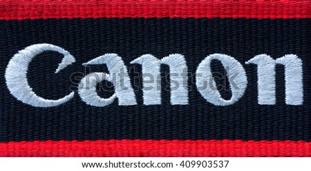 Kamennomostskiy, Russia - 23 April 2016: the Canon Logo on the shoulder strap for the camera