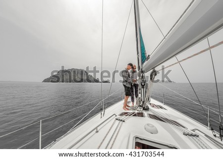 https://thumb1.shutterstock.com/display_pic_with_logo/295900/431703544/stock-photo-couple-on-the-sailing-boat-in-a-sea-with-island-on-the-horizon-431703544.jpg