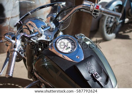Subotica, Serbia-February 25,2017:Green Yamaha DragStar 1100 motorcycle in front of the garage, photographed on a nice sunny day. Ready for restoration. Lot of chrome detail.