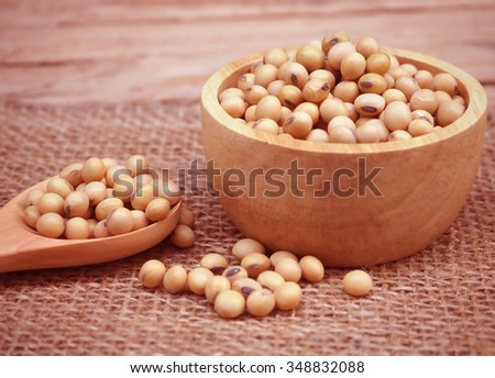 soybean in the wooden cup on the wood table