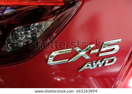 Berlin, Germany - June 19, 2017: Mazda CX-5 AWD logo on red SUV car. The second generation of CX-5 was unveiled with an overhauled design and new tech on November 2016