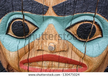 detailed face of totem pole - stock photo