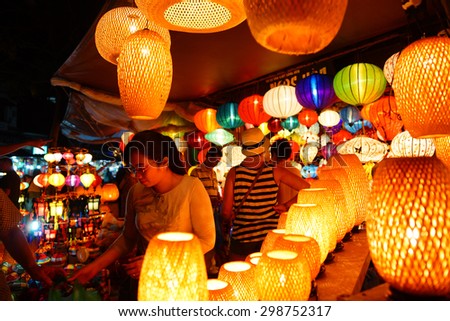 HoiAn, Vietnam - April 2015 - Customers choose silk lantern bazaar display hoi an vietnam