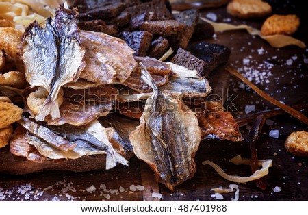 Dried fish to beer, selective focus