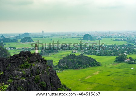 Trang An, Tam Coc, Ninh Binh, Viet nam. It's is UNESCO World Heritage Site, renowned for its boat cave tours. It's Halong Bay on land of Vietnam