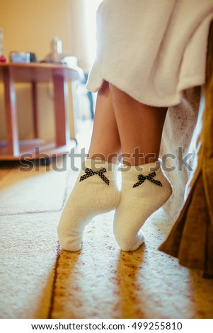 https://thumb1.shutterstock.com/display_pic_with_logo/3042905/499255810/stock-photo-lady-in-white-socks-touches-the-floor-with-her-fingers-499255810.jpg