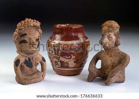 Pre Columbian warriors and pottery made from 600AD to 100BC.  Mayan god painted on small pottery.