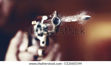 hand gun revolver with flying bullet fire