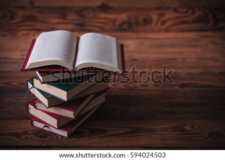 open book on top pile books stock photo royalty free 594024503