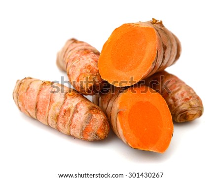 Turmeric roots on white background
