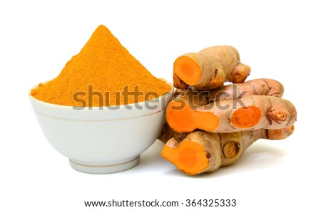 Turmeric roots with turmeric powder isolated on white background