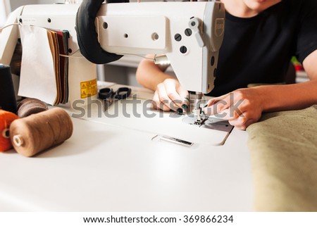 How do you thread a Dressmaker sewing machine?