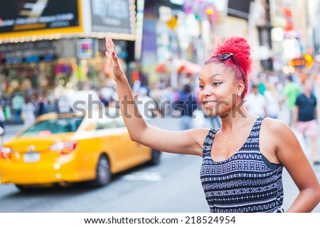 https://thumb1.shutterstock.com/display_pic_with_logo/308011/218524954/stock-photo-beautiful-young-woman-calling-a-cab-in-new-york-218524954.jpg