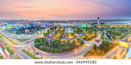Ho Chi Minh City, Vietnam - January 19th, 2015: Sunset on the Tan Son Nhat airport with purple sky, the lights gradually create the panoramic beauty of the airport in Ho Chi Minh City, Vietnam