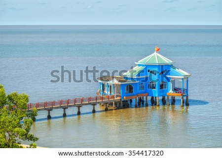 Ca Mau, Vietnam - April 7th, 2015: Floating restaurant on bay with a restaurant guide sea jetties Ca Mau Makes brilliant cape house in bays where the southern end spare fatherland in Ca Mau, Vietnam