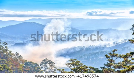 Clouds on hill plateau with clouds threaded through like white velvet carpet covered pine forests, mountainous part sunshine yellow make paintings that adorn countryside