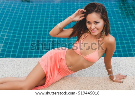 https://thumb1.shutterstock.com/display_pic_with_logo/3122657/519445018/stock-photo-young-asian-sexy-beautiful-woman-in-pink-bikini-lying-at-swimming-pool-slim-tanned-skin-fashion-519445018.jpg