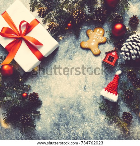 Christmas background, Gift box with red ribbon, Fir branches,toys,decoration,pine cone, string of lights.Holiday advent border,snowflakes,Noel Festive Season Xmas fairy frame.