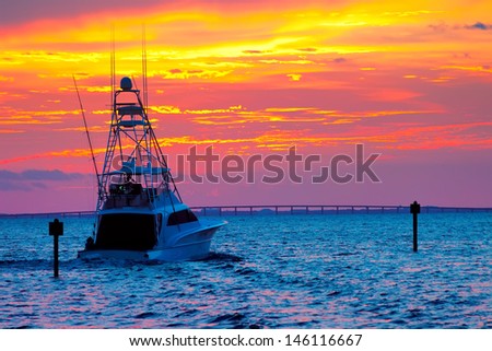 Large fishing boat going out for a sunset cruise in Destin, Florida